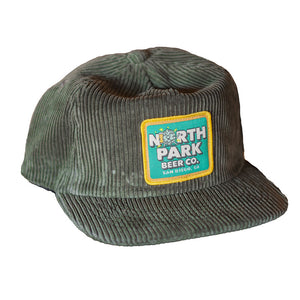 Olive Green wide wale corduroy hat with a colorful patch on front featuring our new Hop Buddy logo. 