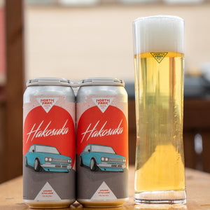 photo of Hakosuka Japanese Lager can beside a glass of beer