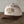 Load image into Gallery viewer, A structured baseball cap with a cream-colored crown and a brown brim, featuring 'NORTH PARK BEER CO SAN DIEGO, CA' embroidered on the front. The cap is displayed on a dark wooden surface against a neutral, textured gray background.
