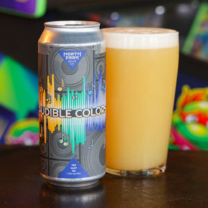 Can of 'Audible Colors' beer next to a glass of beer with a colorful background