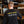 Load image into Gallery viewer, Someone wearing a Black Long Sleeve Tshirt featuring our Art is Hard Buddies across the back and North Park logo above it in yellow and white.
