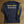 Load image into Gallery viewer, Black long-sleeve shirt with 'North Park' text and graphics on a wooden surface
