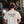 Load image into Gallery viewer, A man viewed from behind wearing a cream-colored t-shirt with 'NORTH PARK BEER CO SAN DIEGO, CALIF. NPBC' printed in black on the back in a brewery setting.
