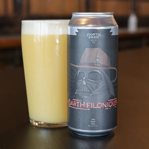 Can of North Park Brewing Co. Darth Filonious beer next to a glass of beer on a wooden surface.