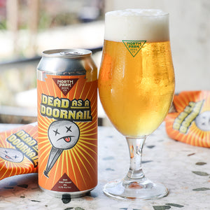 Can of Dead as a Doornail DDH West Coast IPA next to glass of beer