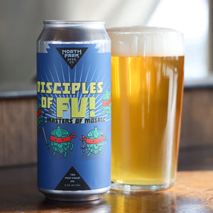 Can of North Park Beer 'Disciples of Fu!' with a glass of beer on a wooden surface.