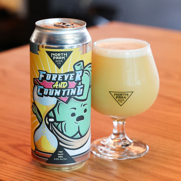 Can of Forever & Counting TDH Hazy DIPA next to glass of beer
