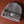 Load image into Gallery viewer, Charcoal Gray Beanie featuring a beige and black triangle logo patch sewn on the front laying on a table.
