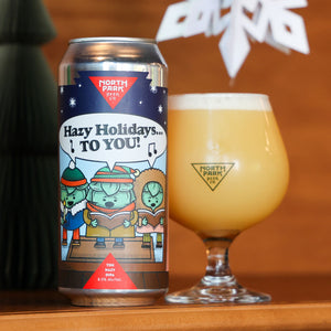 Can of Hazy Holidays to You TDH Hazy DIPA next to glass of beer