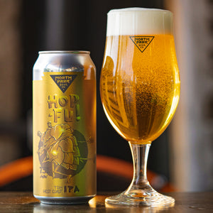 Photo of a gold can of TDH Hop-Fu! TDH West Coast IPA beside a glass of beer