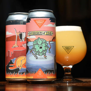 Two cans of Inversion of Time TDH Hazy TIPA next to glass of beer