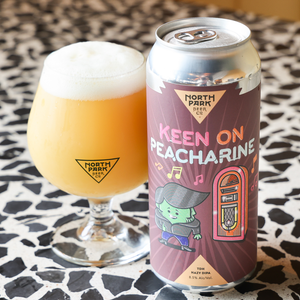 Can of Keen on Peacharine TDH Hazy DIPA next to glass of beer