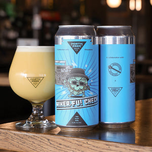 Two cans of 'Miker-Fu! Check' beer with a glass of beer on a bar counter.