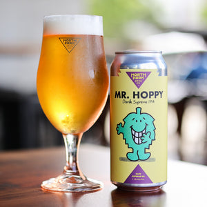 photo of can of Mr. Hoppy Dank Supreme IPA beside a glass of beer
