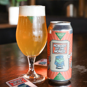 Can of Nobody Get The Money DDH West Coast IPA next to glass of beer