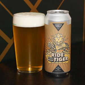 Can of Ride the Tiger West Coast Double IPA next to glass of beer