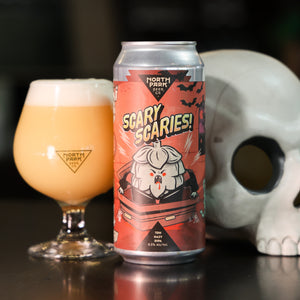 Can of Scary Scaries TDH Hazy Double IPA next to glass of beer