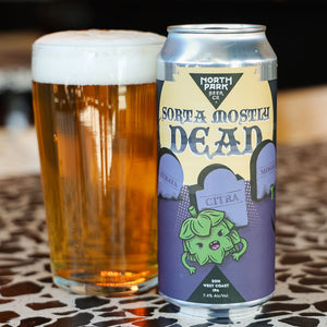 North Park Beer 'Sorta Mostly Dead' can with a glass of beer on a patterned surface