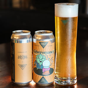 Photo of two cans of Spheromancy West Coast Pilsner next to glass of beer