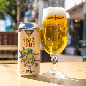 photo of Hop-Fu West Coast IPA can beside a glass of beer
