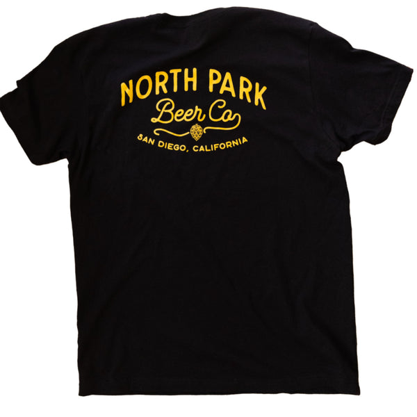 A black t-shirt featuring North Park Beer Co logo in a golden tone on the back