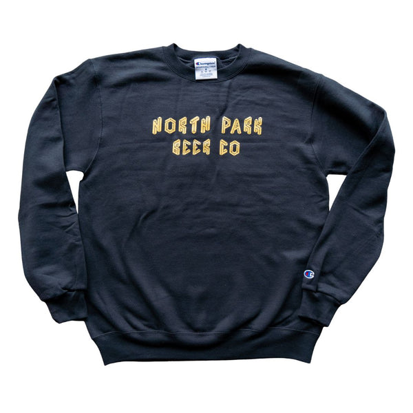 Black Champion sweatshirt with gold North Park Beer Co geometric logo across the front